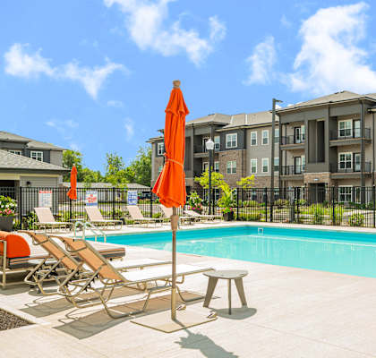 our apartments offer a swimming pool with chairs and umbrellas