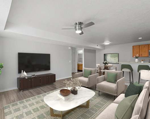A living room with a white coffee table and a green couch. at Eagles Landing, Ammon, ID