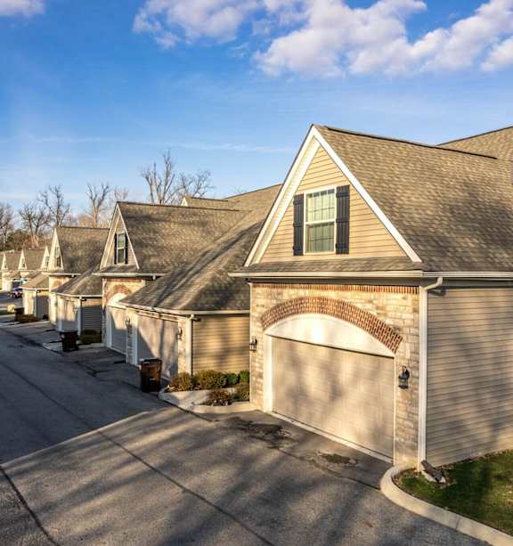 A residential street with houses on both sides at River View at Bexley Apartments, Ohio