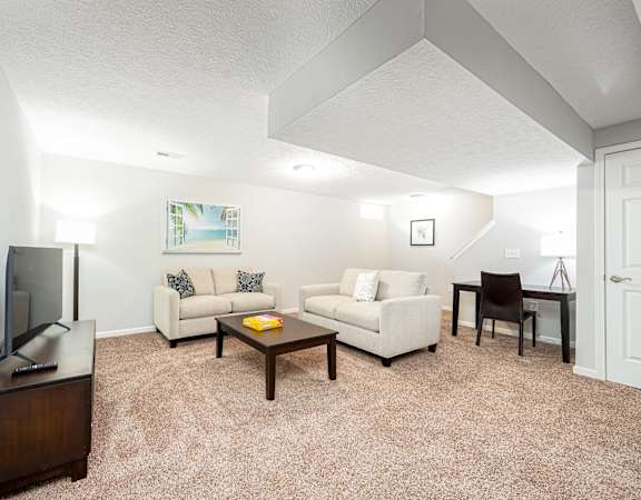a living room with a couch and a table