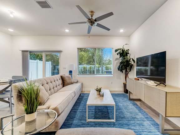 a living room with a couch and a tv