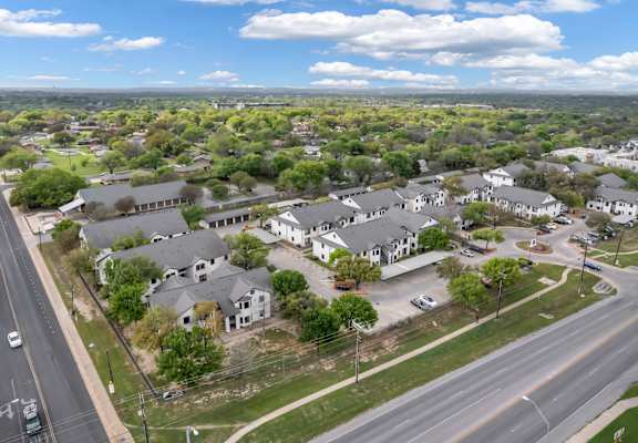 A suburban area with houses and a road.