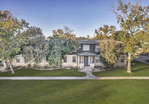 the front of a house with trees and a sidewalk at Sunset Ridge, Texas, 78209