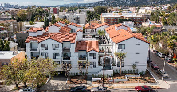 an aerial view of a row of houses in a city