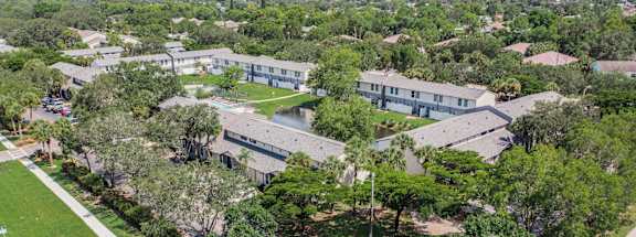 A bird's eye view of a residential area with houses and trees.