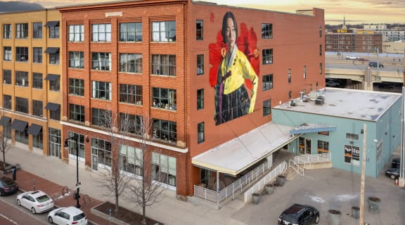 a mural of a woman on the side of a building