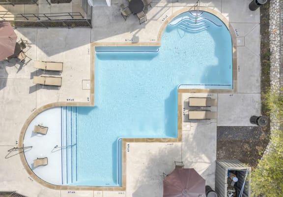arial view of a pool in a hotel with umbrellas