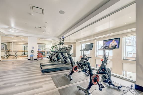 Gym with exercise bikes and a flat screen tv at Alara Union Station, Colorado, 80202