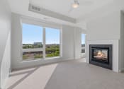 Thumbnail 12 of 28 - Bedroom with Fireplace