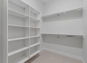 Thumbnail 13 of 28 - Walk-In Closet With Built-In Shelving