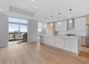 Thumbnail 2 of 32 - Kitchen Area with Hardwood-Style Flooring
