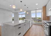 Thumbnail 6 of 32 - Expansive Kitchen Island with Overhead Lighting