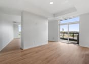 Thumbnail 7 of 32 - Spacious Living Area with Hardwood-Style Flooring