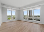 Thumbnail 11 of 32 - Large Living Room Area with Floor to Ceiling Windows