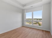 Thumbnail 17 of 32 - Bedroom with Floor to Ceiling Windows