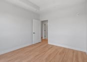 Thumbnail 18 of 32 - Bedroom with Wood Style Flooring