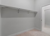 Thumbnail 23 of 32 - Walk-In Closet With Built-In Shelving