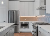 Thumbnail 3 of 27 - Kitchen With Stainless Steel Appliances