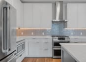 Thumbnail 6 of 27 - Kitchen With Tile Backsplash