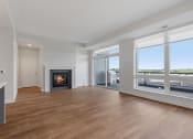 Thumbnail 7 of 27 - Spacious Living Area with Fireplace