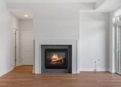 Thumbnail 8 of 27 - Living Area with Fireplace