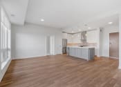 Thumbnail 10 of 27 - Spacious Living Area With Wood-Style Flooring