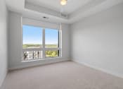 Thumbnail 11 of 27 - Bedroom with Floor to Ceiling Windows