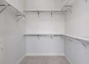 Thumbnail 21 of 27 - Walk-In Closet With Built-In Shelving