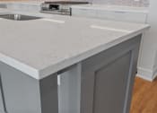 Thumbnail 25 of 27 - Expansive Kitchen Island with Overhead Lighting