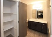 Thumbnail 5 of 14 - A bathroom with a vanity and medicine cabinet.