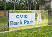 Thumbnail 25 of 26 - A sign for Cvic Bark Park with a dog on it. at AVIA Lofts on Victors Way, Ann Arbor, MI