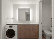 Thumbnail 20 of 29 - A small bathroom with a washing machine and a toilet. at AVIA Lofts on Parkway, Washington