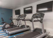 Thumbnail 2 of 26 - A gym with treadmills at AVIA Lofts on Victors Way, Michigan
