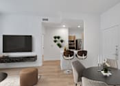 Thumbnail 7 of 12 - Living Room with TV at AVIA Apartments On Alpha, Dallas, TX
