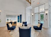 Thumbnail 6 of 33 - Lobby with chairs at AVIA Apartments On Alpha, Dallas, 75240