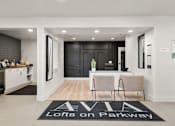 Thumbnail 1 of 15 - A black and white foyer with a rug that says  at AVIA Lofts on Parkway, Vancouver, WA