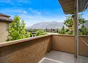 Thumbnail 15 of 17 - A balcony with a view of a mountain range.