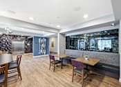 Thumbnail 13 of 22 - A dining area with wooden chairs and tables.