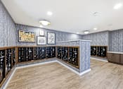 Thumbnail 9 of 22 - A room with a long counter and a wall of cabinets.