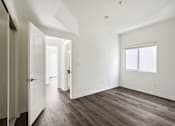 Thumbnail 25 of 48 - Bedroom with Closet, Window, and Vinyl Flooring