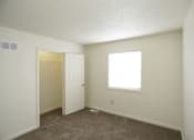 Thumbnail 14 of 36 - Large carpeted bedroom with large closet and window with blinds and vent