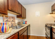Thumbnail 25 of 36 - Kitchen with black appliances