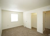Thumbnail 34 of 36 - carpeted bedroom with white walls and a window with shades