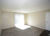 Thumbnail 35 of 36 - large living room with dark grey carpeting and view of front door