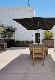 Woman sitting on couch at 2535 Alsace, Los Angeles