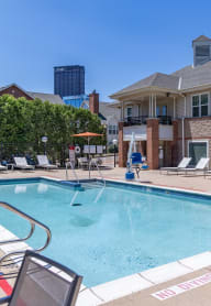 our resort style swimming pool is in front of our house with lounge chairs