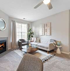 a living room with a couch and a fireplace