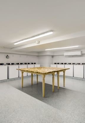 a large room with a table in the middle of it