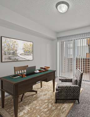A room with a desk, chair, and bookshelf.