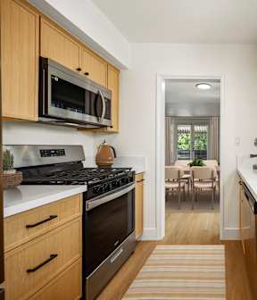 a kitchen and dining area with a table and chairs